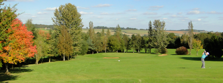 Archive panorama of autumn-coloured trees and open views across Farthingstone’s former golf course, with golf details still visible.